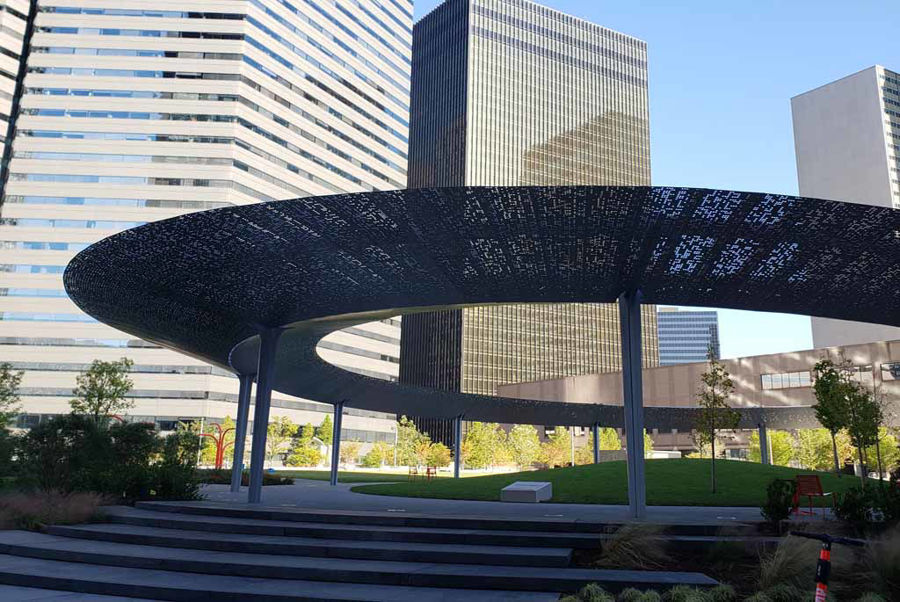 FINAL INSTALLATION PICTURE: Rare Curved Aluminum Material Creates Overhead Canopy at Pacific Plaza in Dallas, TX.